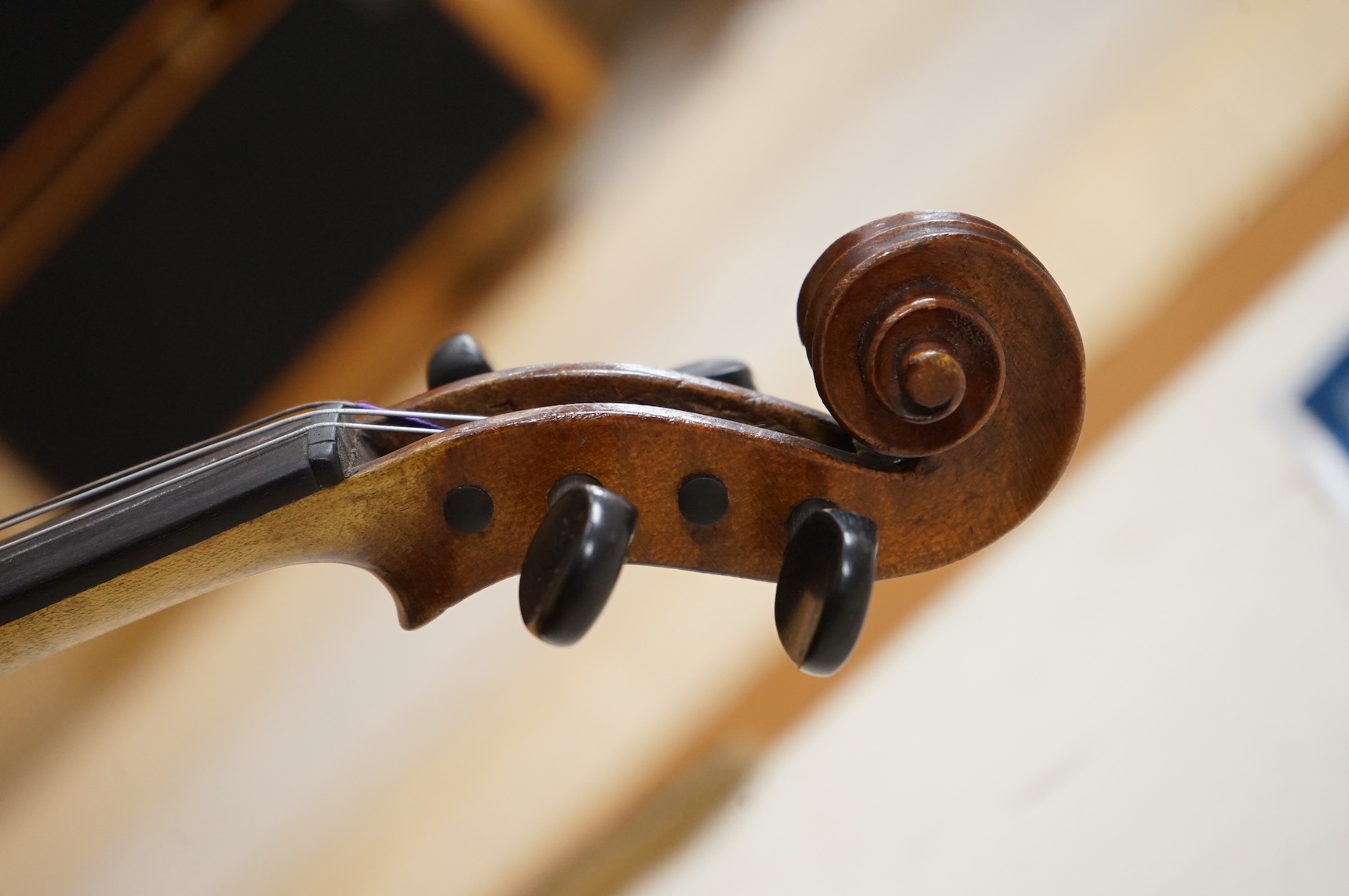 A cased late 19th century violin, signed ‘Nicolas Bertolini’, back 36.3cm, with bow stamped Paesold, CITES Submission reference, D9GSYMLJ